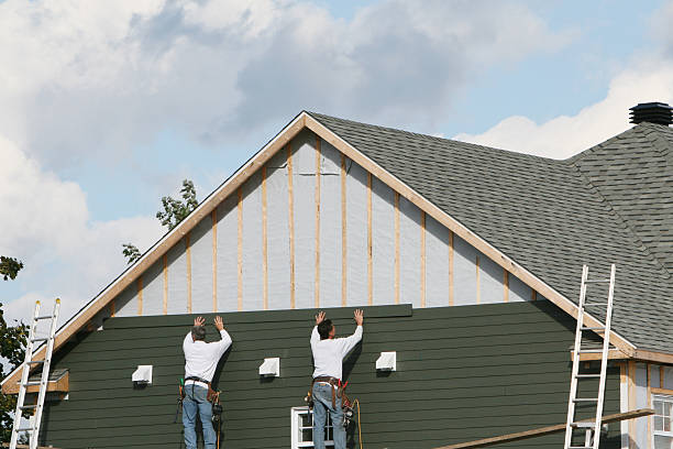 Professional Storm Damage Siding Repair technician working in Phoenix, NY